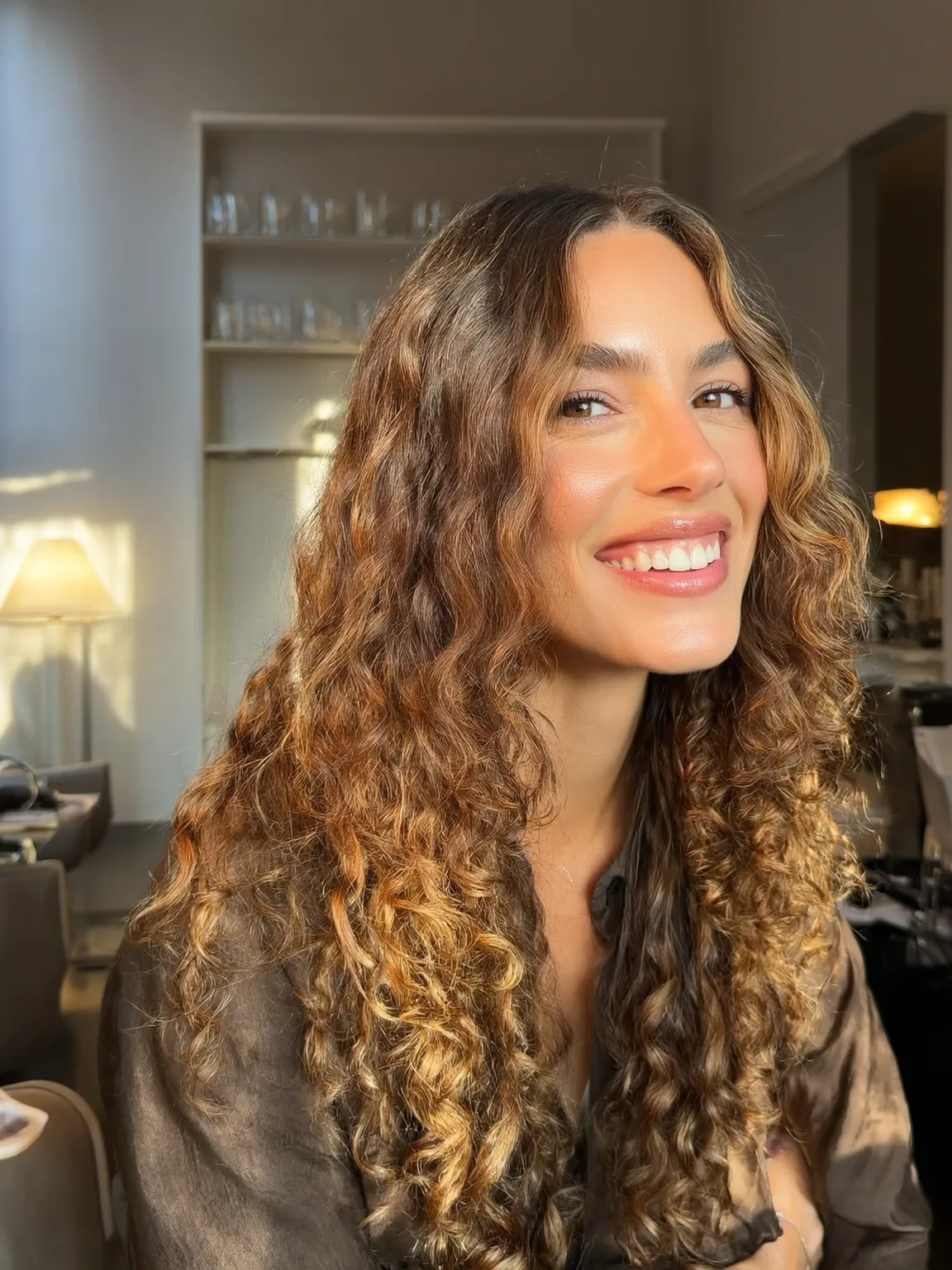 Curly Long Layers in Golden Caramel with Honey Highlights